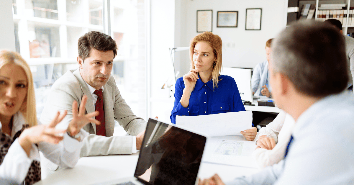 Colleagues discussing in a meeting.